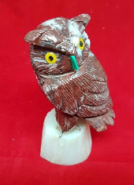 Hand Carved Owl Standing on a Slab